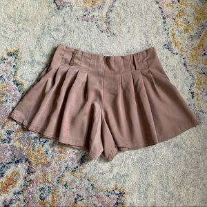 Tan flared and pleated shorts